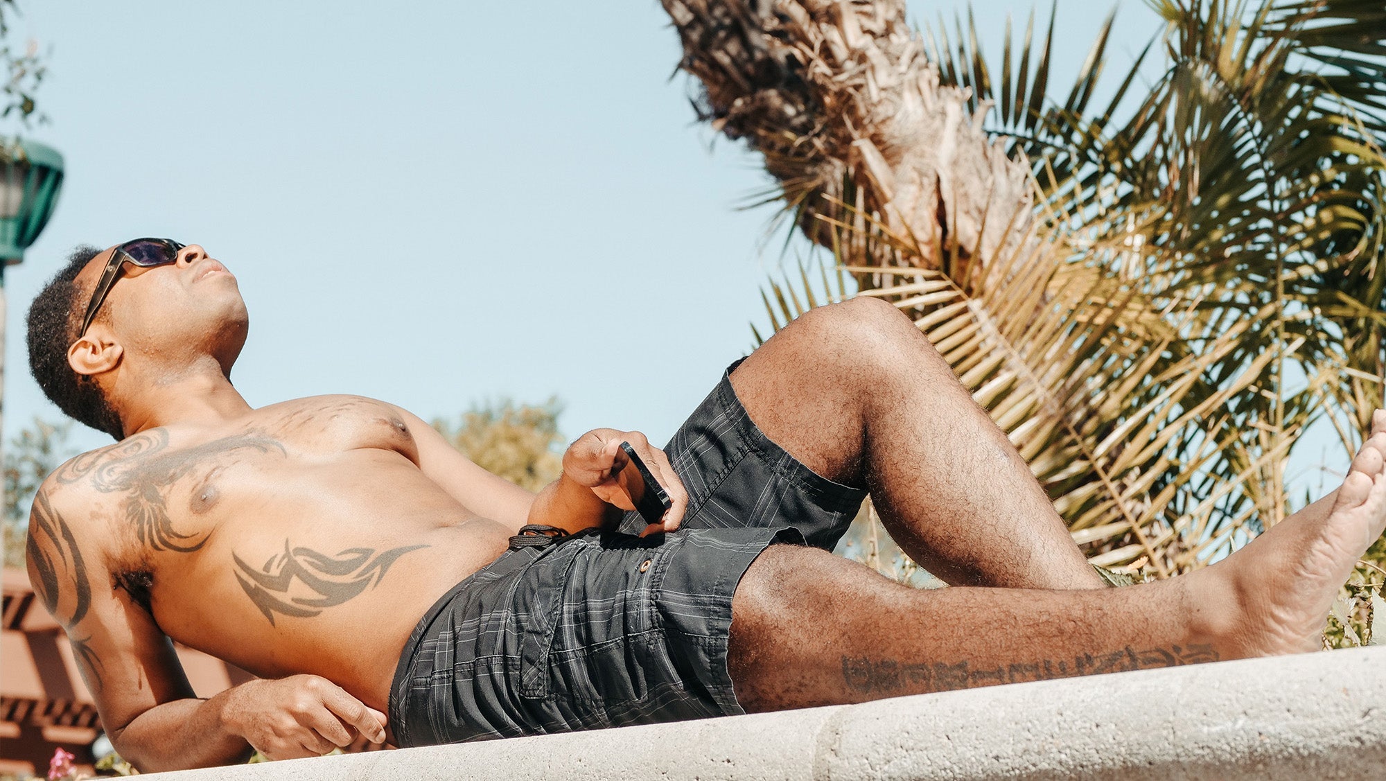 Men Are Tanning Again. Here's the Smart Way To Do It.